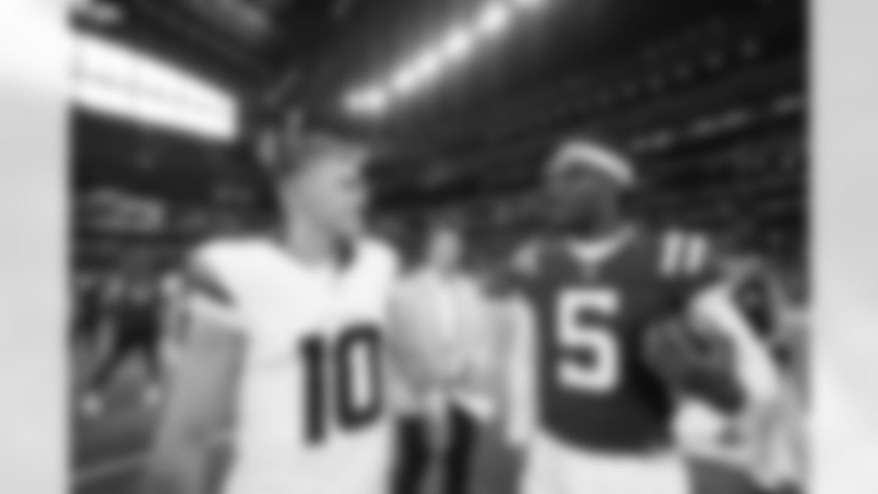 Bo Nix #10 of the Denver Broncos talks with Anthony Richardson #5 of the Indianapolis Colts after the Broncos' preseason Week 1 game against the Indianapolis Colts at Lucas Oil Stadium in Indianapolis, Indiana on August 11, 2024. (Photo by Ben Swanson/Denver Broncos)