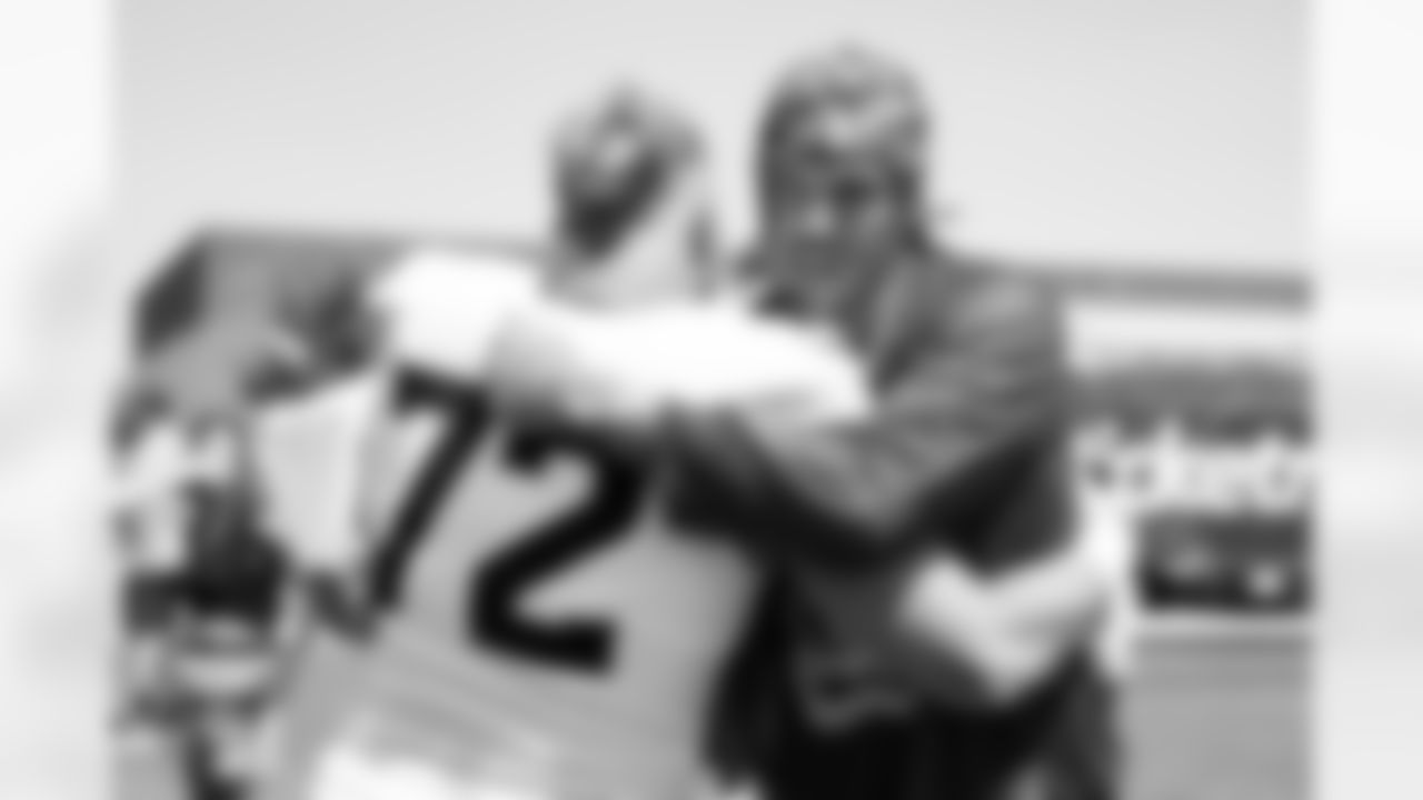 Garett Bolles talks with Denver Nuggets player Aaron Gordon during a training camp practice at Broncos Park Powered by CommonSpirit on August 13, 2025 in Englewood, Colorado. Photo by Ben Swanson / Denver Broncos