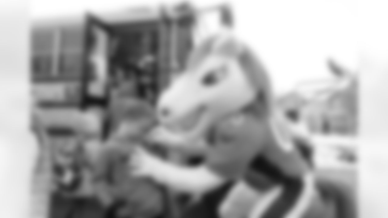 Miles the Mascot rode an Aurora Public Schools bus to pick up kids and accompany them to school as part of Random Acts of Kindness week in Aurora, Colorado on February 12, 2024. Photo by Gabriel Christus / Denver Broncos
