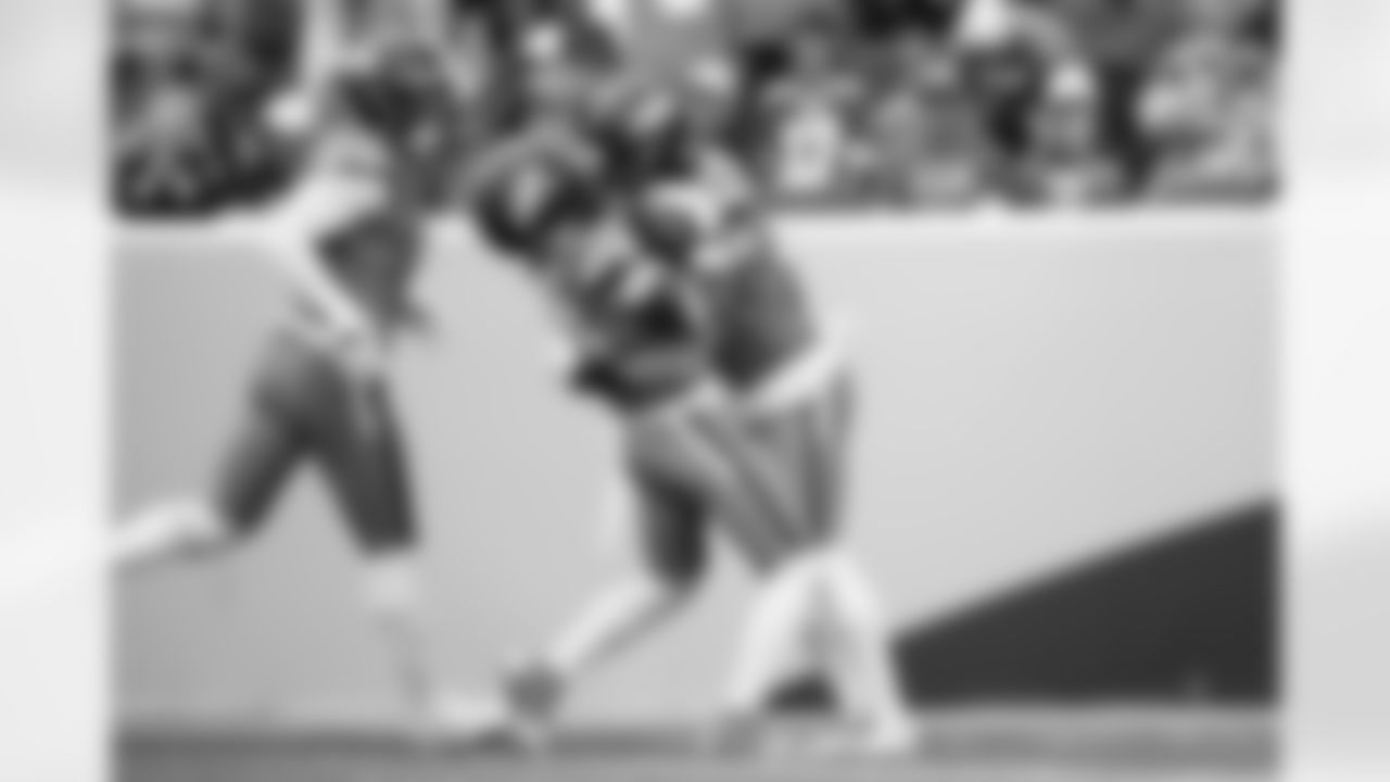 Denver Broncos linebacker Alex Singleton (49) celebrates with cornerback Jahdae Barron (23) after Barron recovered a fumble during the Broncos' Week 1 game against the Tennessee Titans at Empower Field at Mile High in Denver, Colorado on September 7, 2025. Photo by Ben Swanson / Denver Broncos