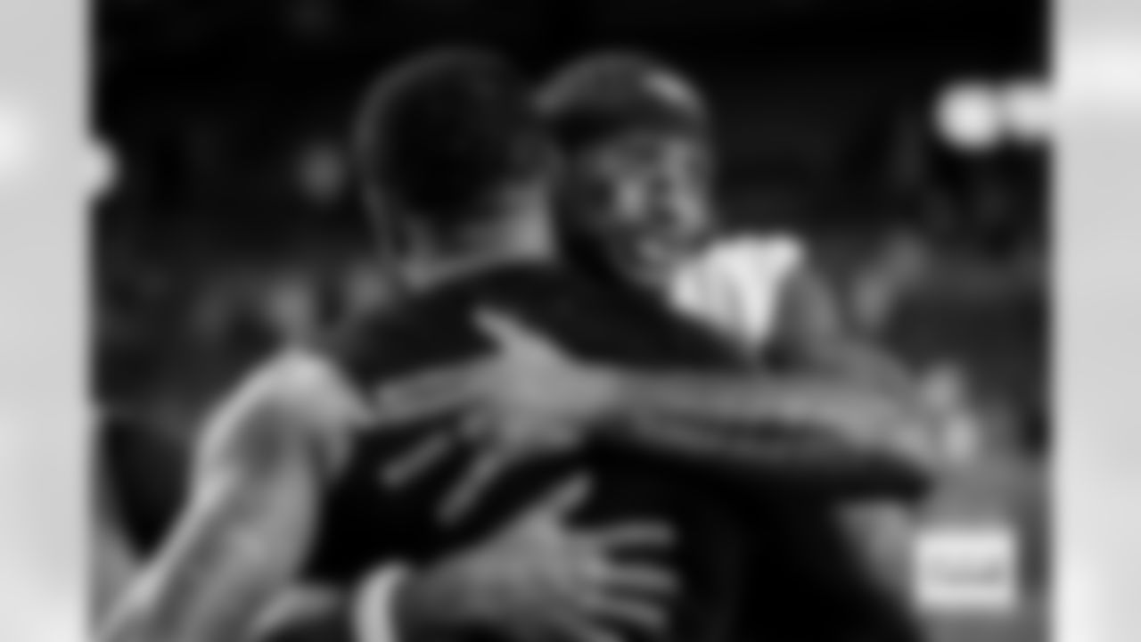 Denver Broncos wide receiver Courtland Sutton (14) hugs Jacksonville Jaguars wide receiver Tim Patrick (17) after the Broncos' Week 16 game against the Jacksonville Jaguars at Empower Field at Mile High in Denver, Colorado on December 21, 2025. Photo by Ben Swanson / Denver Broncos