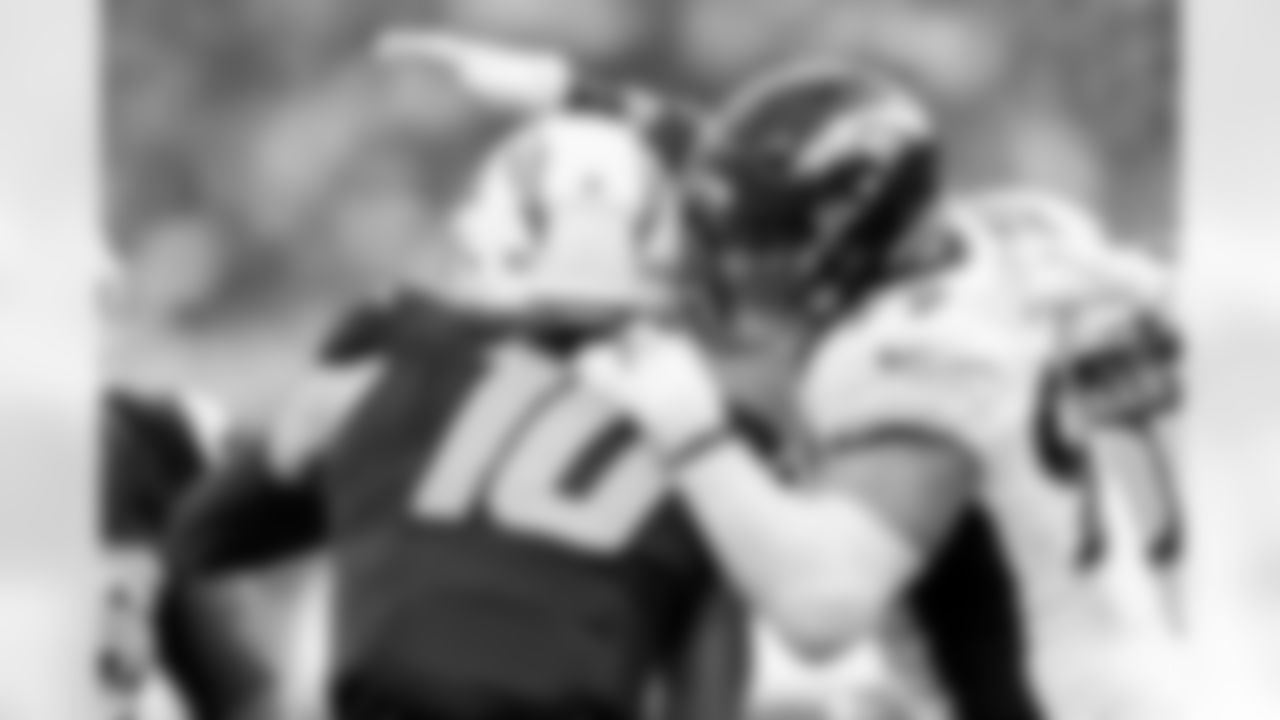 Denver Broncos defensive end Zach Allen (99) sacks Los Angeles Chargers quarterback Justin Herbert (10) during the Broncos' Week 14 game against the Los Angeles Chargers at SoFi Stadium in Inglewood, California on December 10, 2023. Photo by Gabriel Christus / Denver Broncos