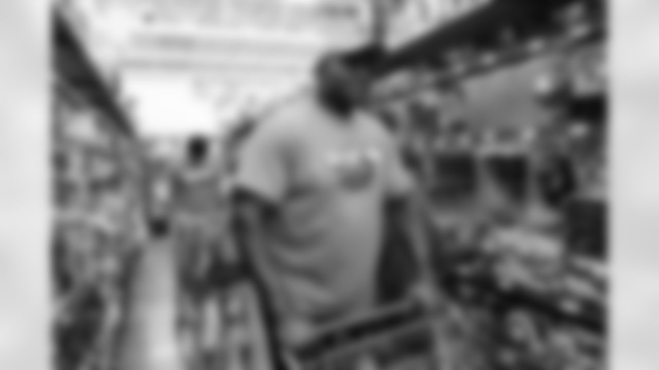 Children from the Denver Broncos Boys & Girls Club participate in a Shop with a Jock shopping spree with Broncos players, alumni and cheerleader alumni in Aurora, Colorado on December 2, 2025. Photo by Ben Swanson / Denver Broncos