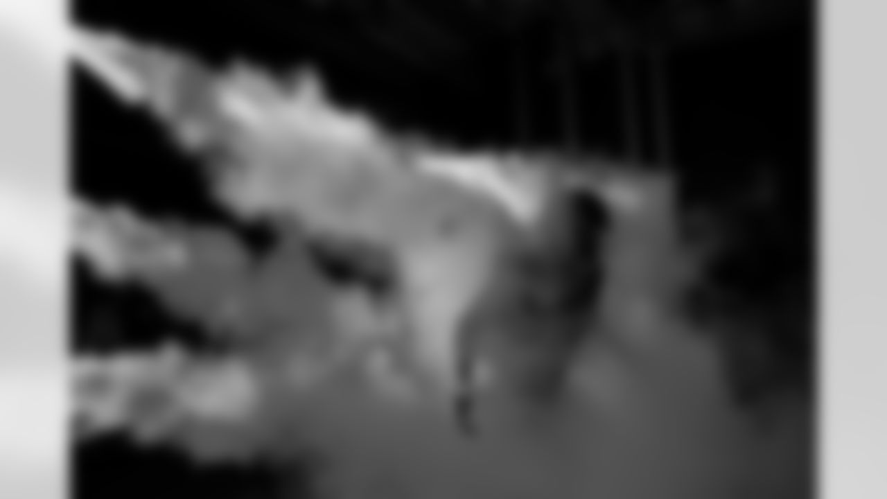 Denver Broncos defensive tackle D.J. Jones (93) runs through the smoke in the tunnel during player and team introductions before the Broncos' Week 10 game against the Las Vegas Raiders at Empower Field at Mile High in Denver, Colorado on November 6, 2025. Photo by Ben Swanson / Denver Broncos