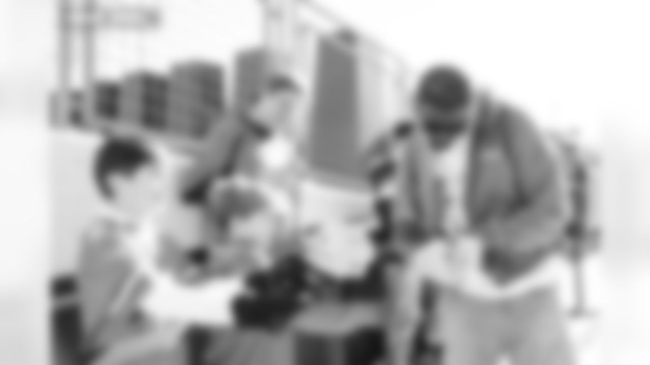 JL Skinner signs autographs for fans during team arrivals before the Broncos' Divisional Round playoff game against the Buffalo Bills at Empower Field at Mile High in Denver, Colorado on January 17, 2026. Photo by Ben Swanson / Denver Broncos