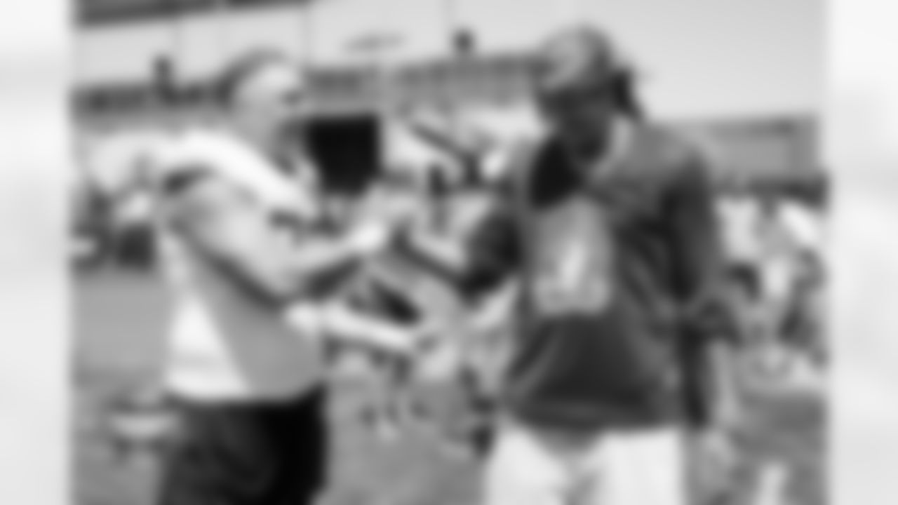 Garett Bolles greets Denver Nuggets player Aaron Gordon during a training camp practice at Broncos Park Powered by CommonSpirit on August 13, 2025 in Englewood, Colorado. Photo by Ben Swanson / Denver Broncos