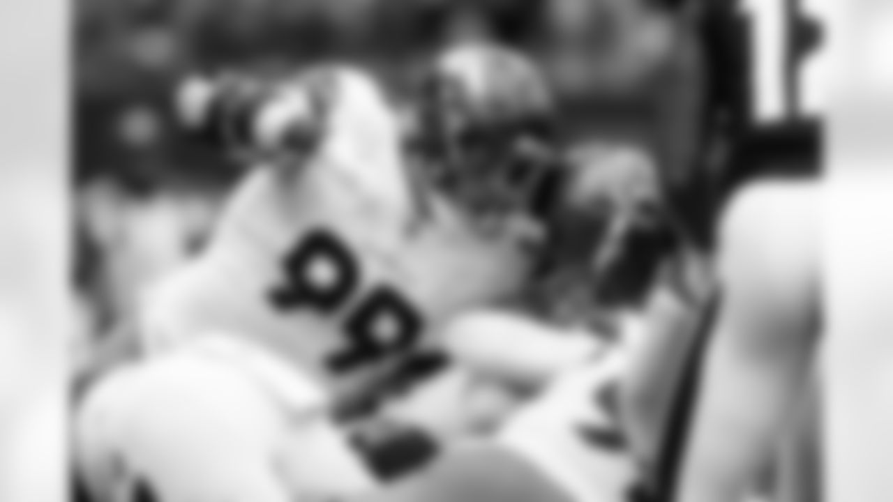 Denver Broncos defensive end Zach Allen (99) stops Houston Texans quarterback Davis Mills (10) short of the goal line during the Broncos' Week 9 game against the Houston Texans at NRG Stadium in Houston, Texas on November 2, 2025. Photo by Ben Swanson / Denver Broncos