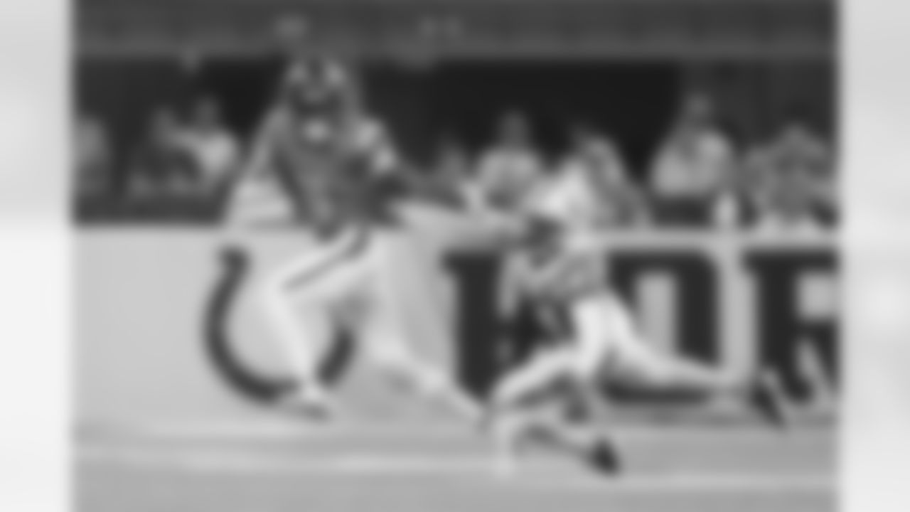 Denver Broncos wide receiver Troy Franklin (11) pushes Indianapolis Colts cornerback Kenny Moore II (23) away as he runs with the ball during the Broncos' Week 2 game against the Indianapolis Colts at Lucas Oil Stadium in Indianapolis, Indiana on September 14, 2025. Photo by Gabriel Christus / Denver Broncos