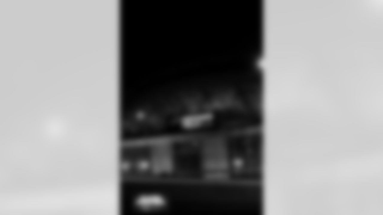 The exterior of Empower Field at Mile High is lit up orange and blue for the playoffs in Denver, Colorado on January 12, 2026. Photo by Ben Swanson / Denver Broncos