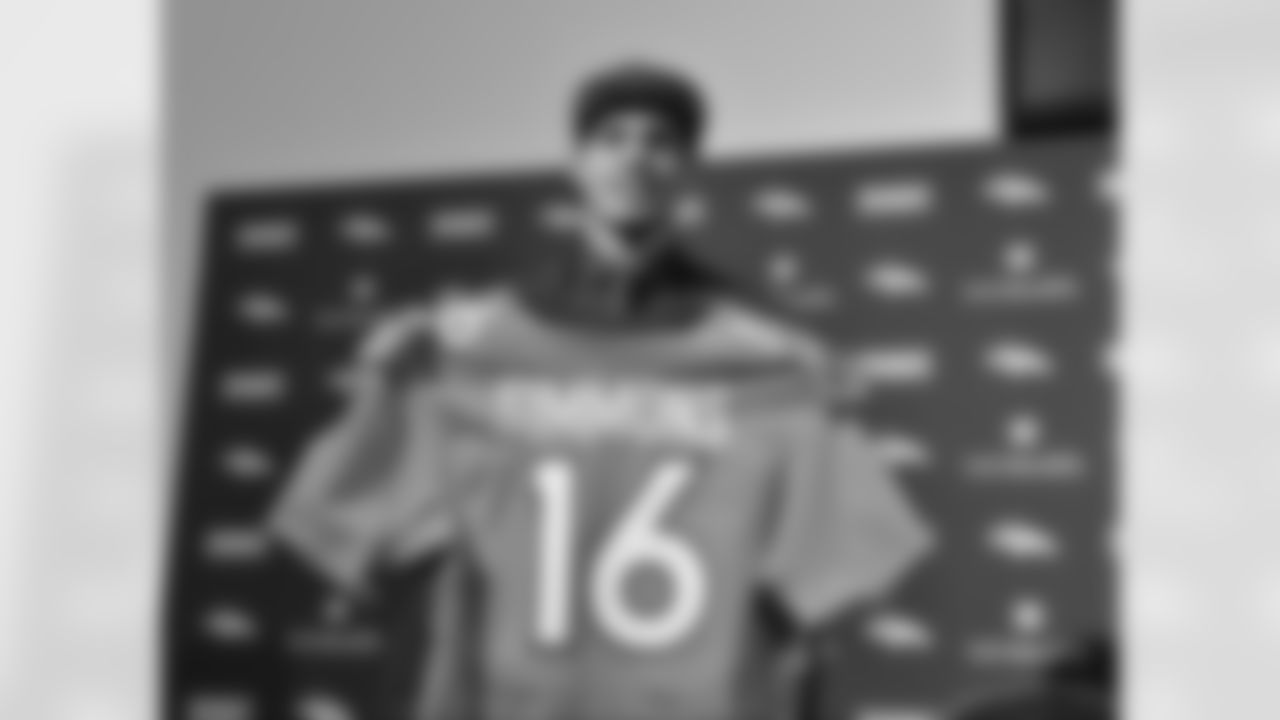Denver Broncos second round selection Justin Simmons shows his draft jersey during the 2016 NFL Draft at Denver Broncos headquarters in Englewood, Colo. April 30, 2016.