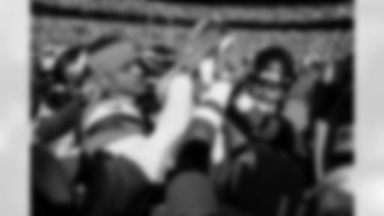 Denver Broncos cornerback Pat Surtain II (2), cornerback Riley Moss (21) and the defensive backs hold the ball up in a huddle before the Broncos' Divisional Round playoff game against the Buffalo Bills at Empower Field at Mile High in Denver, Colorado on January 17, 2026. Photo by Gabriel Christus / Denver Broncos