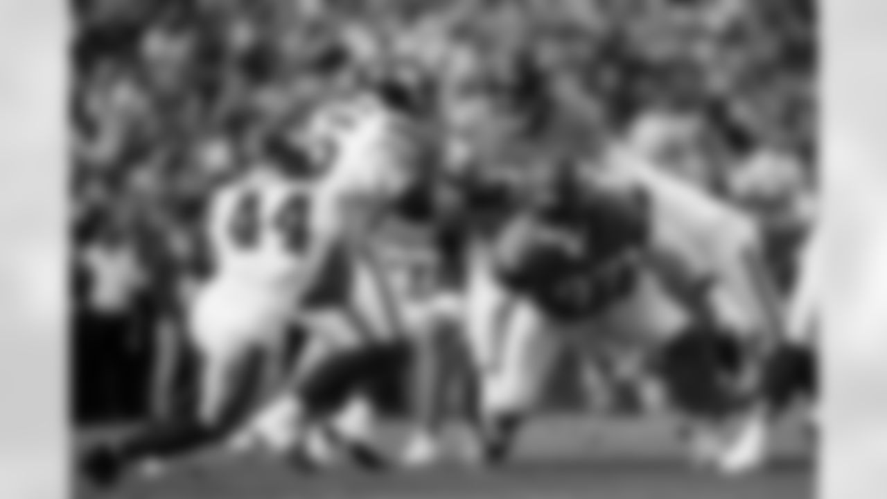 Denver Broncos defensive tackle Malcolm Roach (97) and defensive end Zach Allen (99) tackle New York Giants running back Cam Skattebo (44) during the Broncos' Week 7 game against the New York Giants at Empower Field at Mile High in Denver, Colorado on October 19, 2025. Photo by Ben Swanson / Denver Broncos