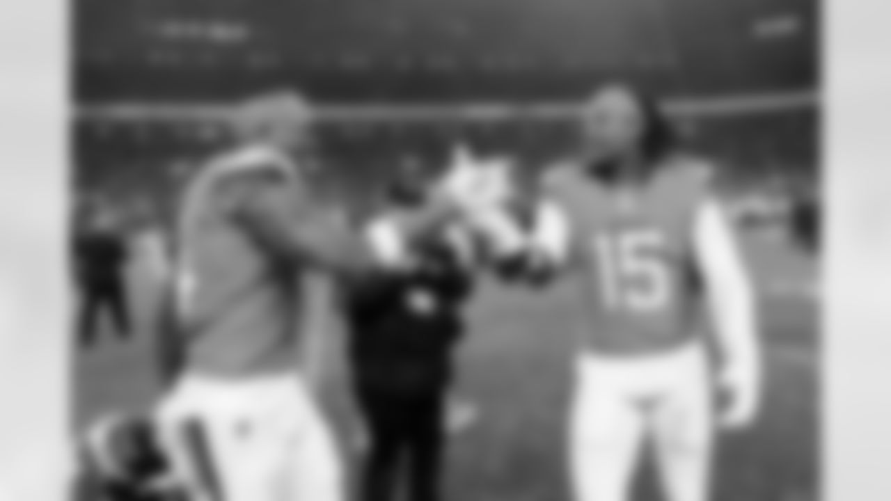 Denver Broncos wide receiver Courtland Sutton (14) celebrates with linebacker Nik Bonitto (15) after the Broncos' Divisional Round playoff game against the Buffalo Bills at Empower Field at Mile High in Denver, Colorado on January 17, 2026. Photo by Ben Swanson / Denver Broncos