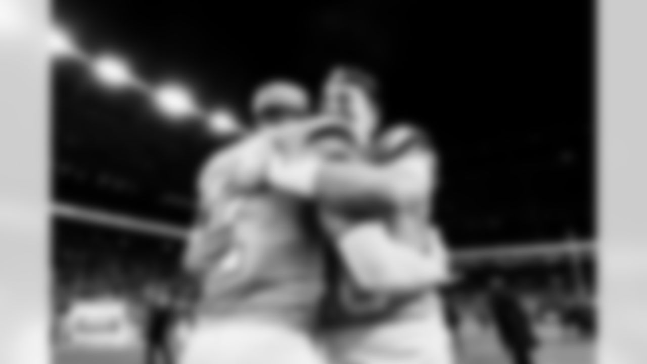 Denver Broncos cornerback Pat Surtain II (2) and quarterback Bo Nix (10) embrace after the Broncos' Divisional Round playoff game against the Buffalo Bills at Empower Field at Mile High in Denver, Colorado on January 17, 2026. Photo by Gavin Liddell / Denver Broncos