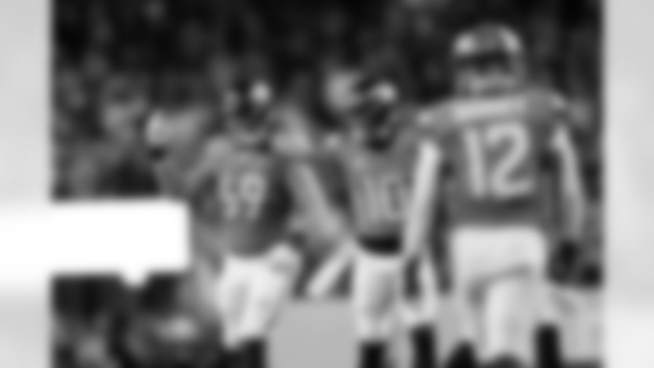 Denver Broncos quarterback Bo Nix (10) and offensive tackle Mike McGlinchey (69) communicate with the sideline to go for two points after a touchdown during the Broncos' Week 15 game against the Green Bay Packers at Empower Field at Mile High in Denver, Colorado on December 14, 2025. Photo by Gabriel Christus / Denver Broncos