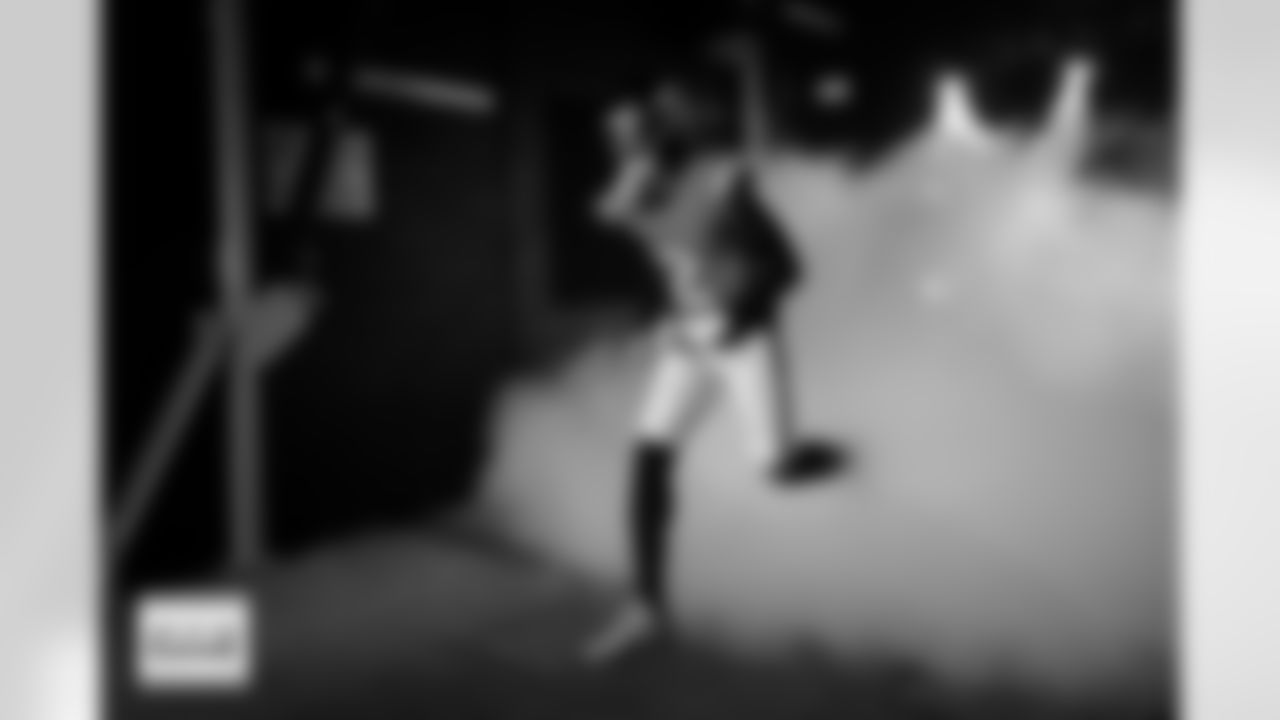 Denver Broncos cornerback Pat Surtain II (2) runs out of the tunnel during player and team introductions before the Broncos' Week 15 game against the Green Bay Packers at Empower Field at Mile High in Denver, Colorado on December 14, 2025. Photo by Ben Swanson / Denver Broncos