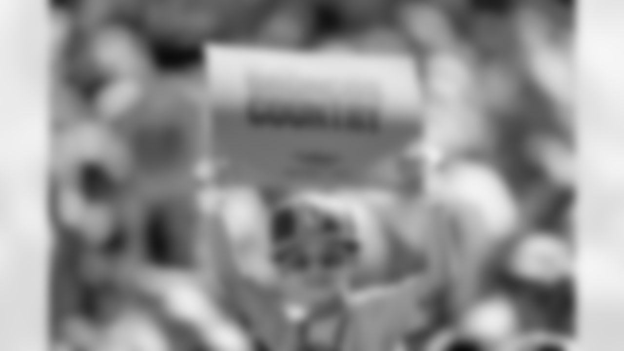 A fan holds up a sign as part of a card stunt before the Broncos' Week 1 game against the Tennessee Titans at Empower Field at Mile High in Denver, Colorado on September 7, 2025. Photo by Ben Swanson / Denver Broncos