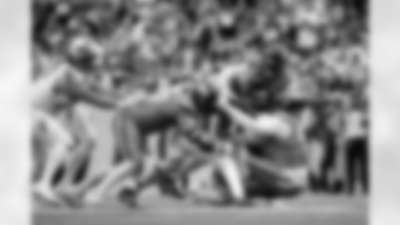 Denver Broncos defensive end Zach Allen (99), linebacker Jonathon Cooper (0) and defensive tackle D.J. Jones (93) tackle Tennessee Titans running back Tony Pollard (20) during the Broncos' Week 1 game against the Tennessee Titans at Empower Field at Mile High in Denver, Colorado on September 7, 2025. Photo by Ben Swanson / Denver Broncos