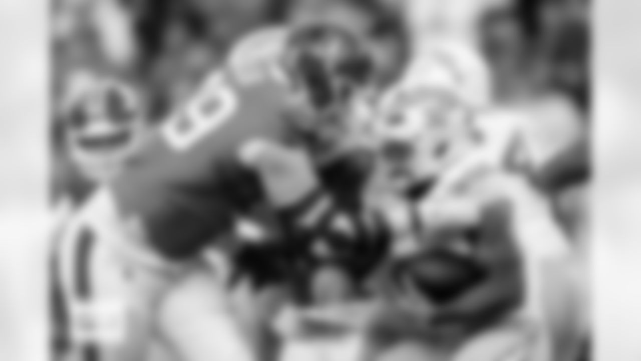 Zach Allen tackles Jaret Patterson during the Broncos' Week 18 game against the Los Angeles Chargers at Empower Field at Mile High in Denver, Colorado on January 4, 2026. Photo by Ben Swanson / Denver Broncos