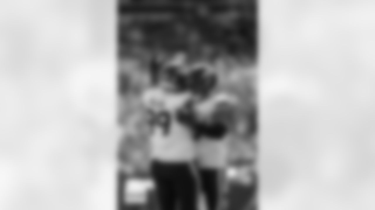 Denver Broncos defensive end Zach Allen (99) and linebacker Nik Bonitto (15) celebrate after a sack during the Broncos' Week 5 game against the Philadelphia Eagles at Lincoln Financial Field in Philadelphia, Pennsylvania on October 5, 2025. Photo by Gabriel Christus / Denver Broncos