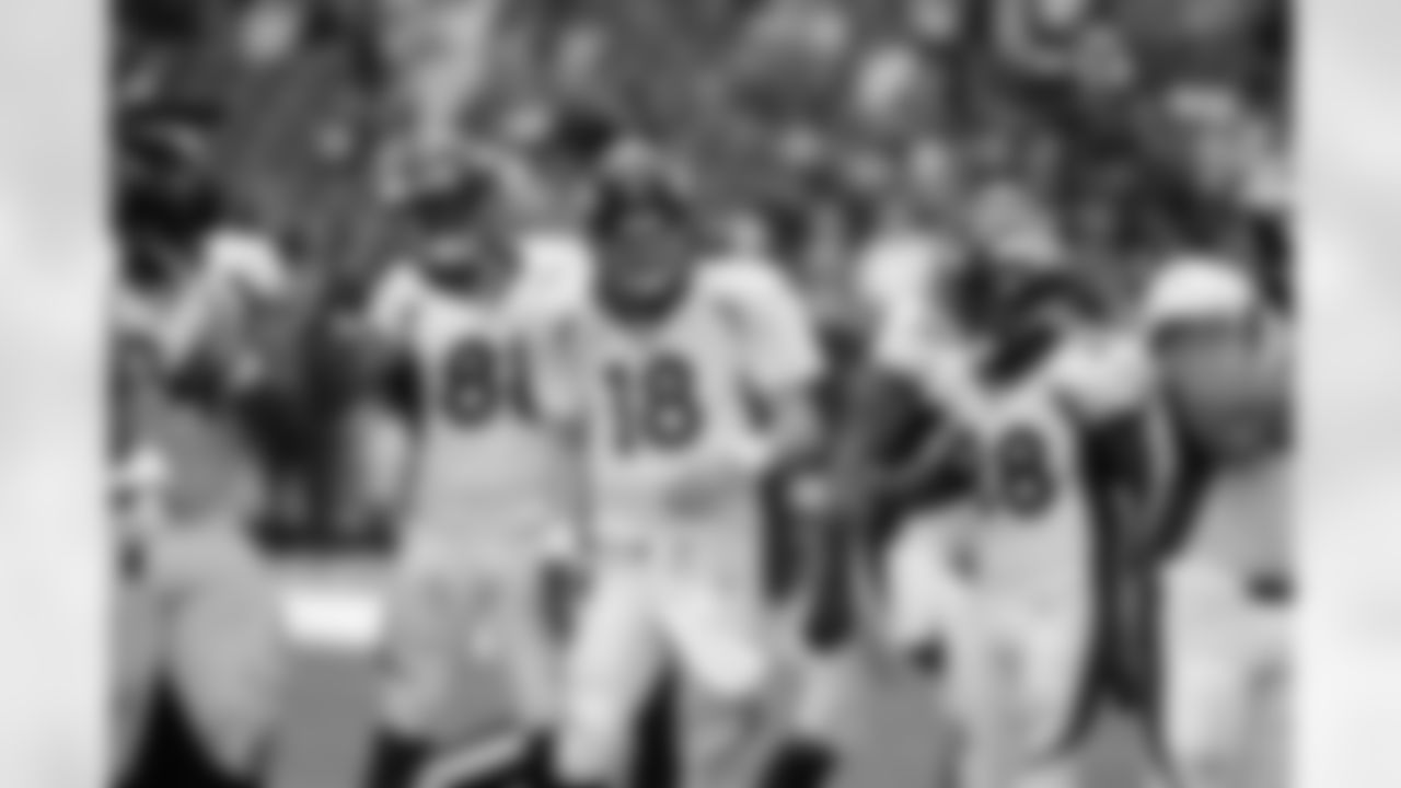 Denver Broncos quarterback Peyton Manning (18) is congratulated by Demaryius Thomas (88) after throwing the touchdown pass that set a new NFL record of 51 touchdown passes during a regular season during the NFL game against the Houston Texans in Houston on December 22, 2013.