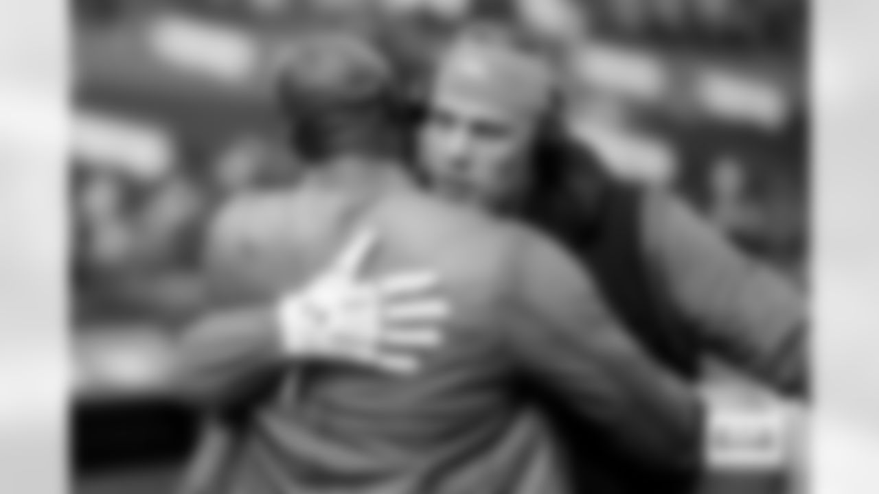 Garett Bolles hugs DeMarcus Ware before the Broncos' Week 7 game against the New York Giants at Empower Field at Mile High in Denver, Colorado on October 19, 2025. Photo by Ben Swanson / Denver Broncos