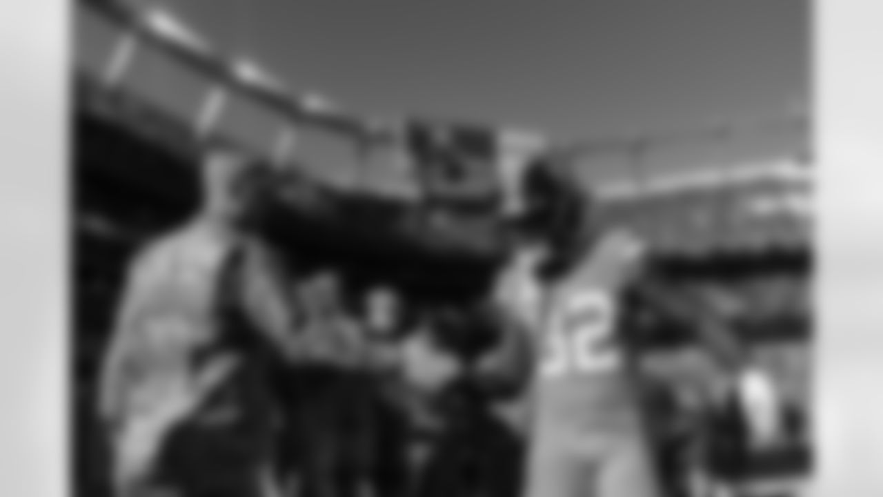 Delarrin Turner-Yell high-fives military service members on his way off the field during warmups before the Broncos' Week 11 game against the Las Vegas Raiders at Empower Field at Mile High in Denver, Colorado on November 20, 2022. (Photo by Ben Swanson)
