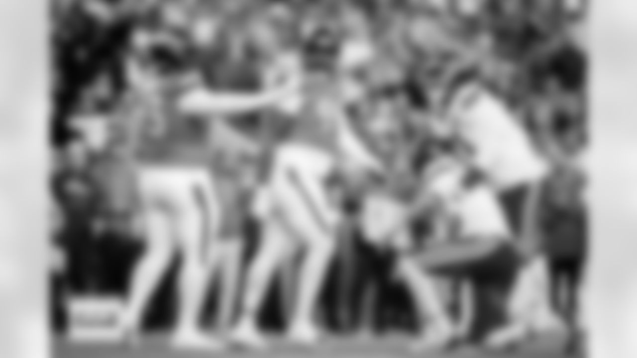 Denver Broncos defensive tackle D.J. Jones (93) reacts after a play as Kansas City Chiefs offensive tackle Josh Simmons (71) helps quarterback Patrick Mahomes (15) to his feet during the Broncos' Week 11 game against the Kansas City Chiefs at Empower Field at Mile High in Denver, Colorado on November 16, 2025. Photo by Ben Swanson / Denver Broncos