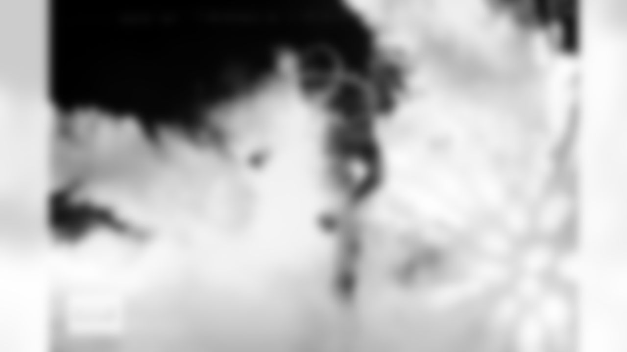 Denver Broncos safety Talanoa Hufanga (9) runs through the smoke in the tunnel during player and team introductions before the Broncos' Week 10 game against the Las Vegas Raiders at Empower Field at Mile High in Denver, Colorado on November 6, 2025. Photo by Ben Swanson / Denver Broncos