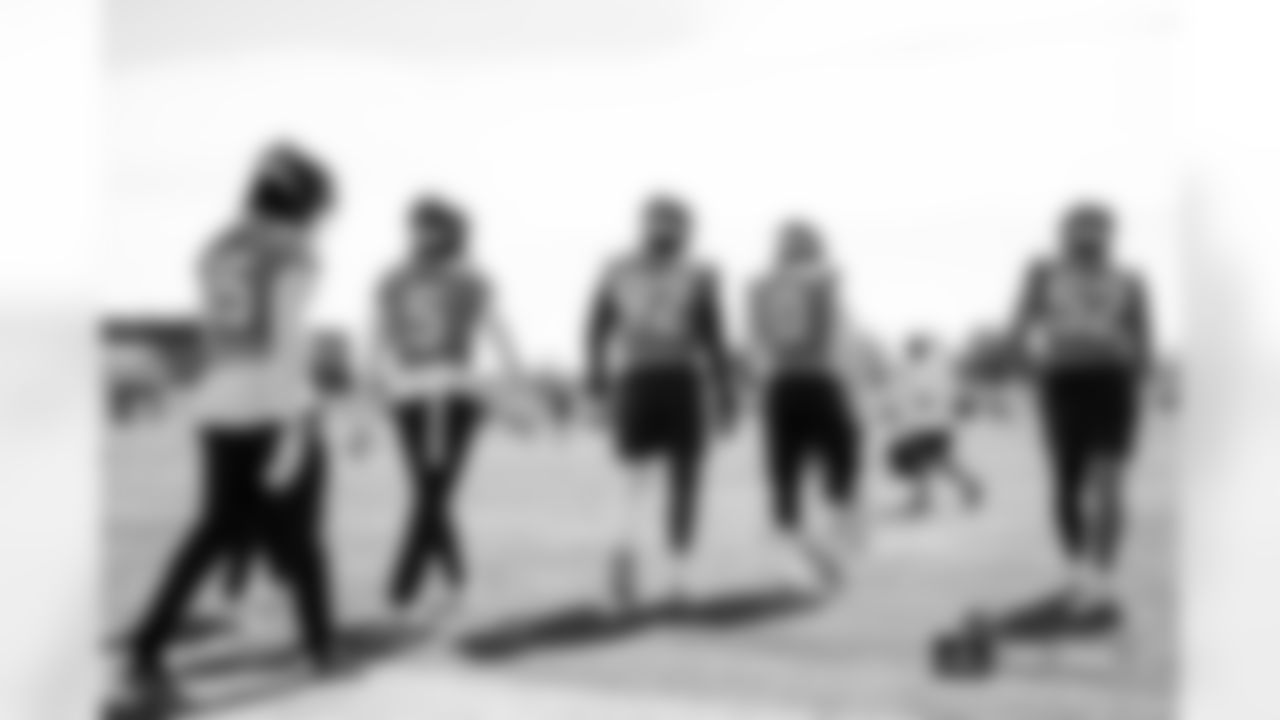The outside linebackers walk to their next drill during practice at Broncos Park Powered by CommonSpirit in Englewood, Colorado on September 12, 2024. Photo by Ben Swanson / Denver Broncos