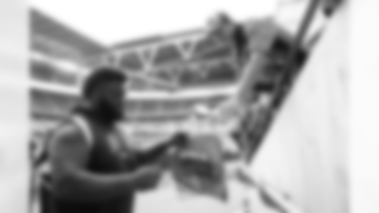 D.J. Jones signs autographs for fans during an international NFL game against the Jacksonville Jaguars at Wembley Stadium on Sunday, October 30, 2022 in London.
Photo by Gabriel Christus / Denver Broncos
