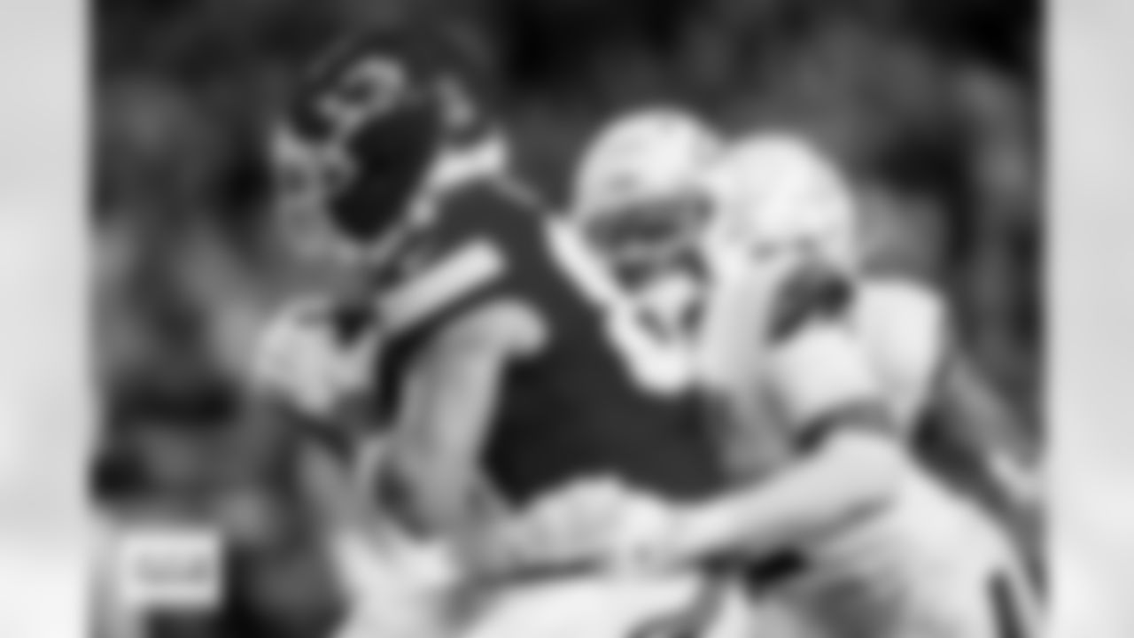 Denver Broncos cornerback Pat Surtain II (2) tackles Kansas City Chiefs tight end Travis Kelce (87) during the Broncos' Week 17 game against the Kansas City Chiefs at GEHA Field at Arrowhead Stadium in Kansas City, Missouri on December 25, 2025. Photo by Ben Swanson / Denver Broncos