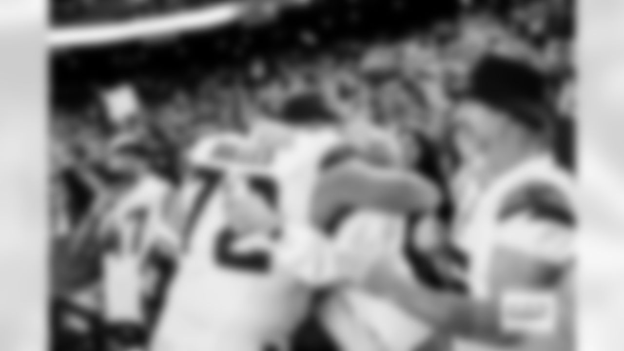 Denver Broncos offensive tackle Garett Bolles (72) hugs family after the Broncos' Week 14 game against the Las Vegas Raiders at Allegiant Stadium in Las Vegas, Nevada on December 7, 2025. Photo by Ben Swanson / Denver Broncos