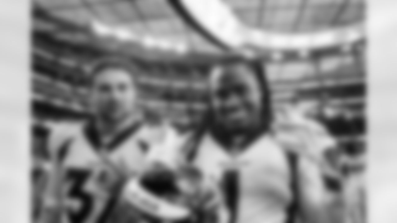 Riley Moss and Tremon Smith celebrate after the Broncos' Week 14 game against the Los Angeles Chargers at SoFi Stadium in Inglewood, California on December 10, 2023. Photo by Ben Swanson / Denver Broncos
