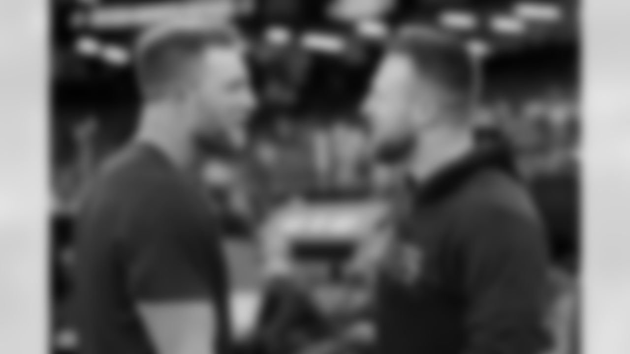 Denver Broncos tight end Adam Trautman, left, talks with New Orleans Saints tight end Taysom Hill, right, before an NFL football game, Thursday, Oct. 17, 2024, in New Orleans. (AP Photo/Gerald Herbert)