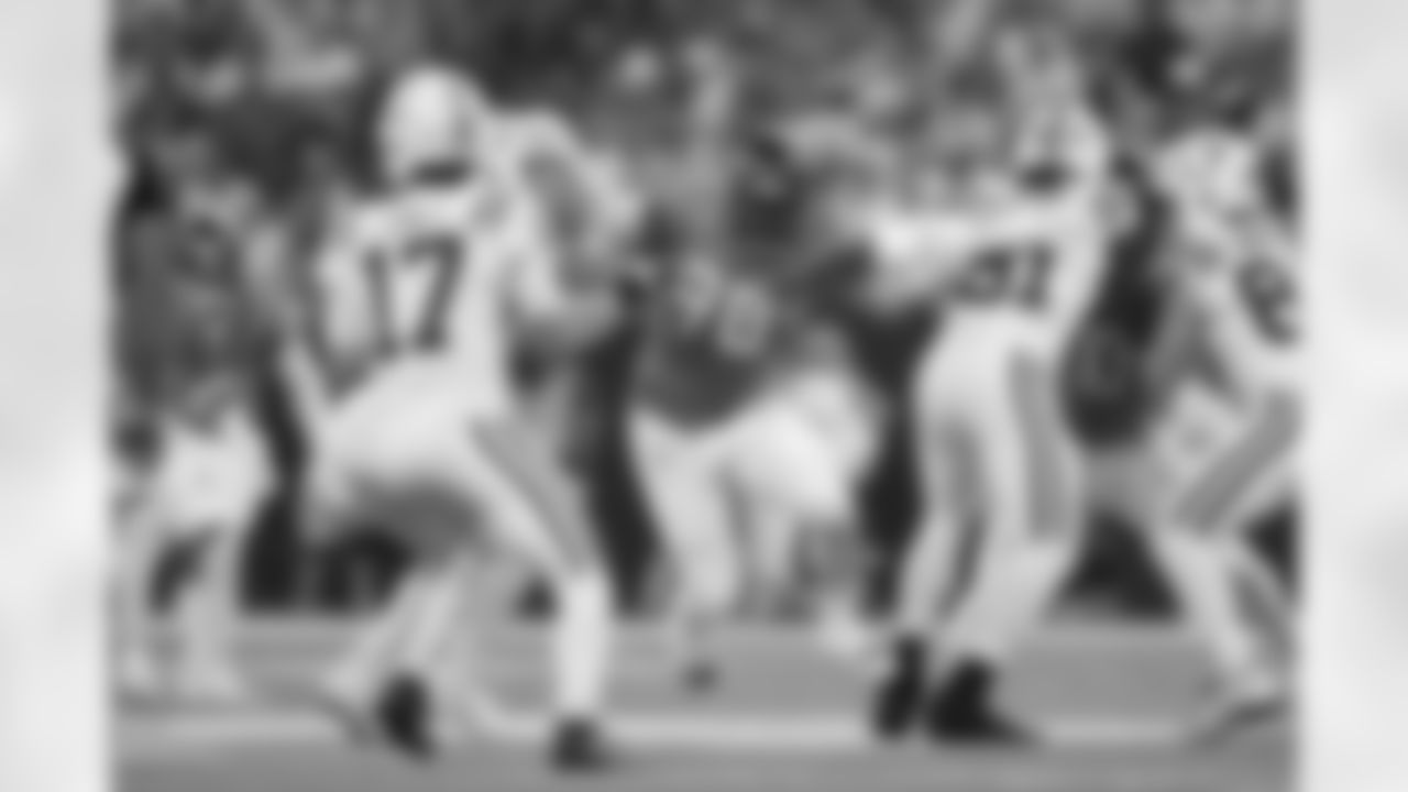 Denver Broncos defensive end John Franklin-Myers (98) leaps between two Colts players during the Broncos' Week 2 game against the Indianapolis Colts at Lucas Oil Stadium in Indianapolis, Indiana on September 14, 2025. Photo by Ben Swanson / Denver Broncos