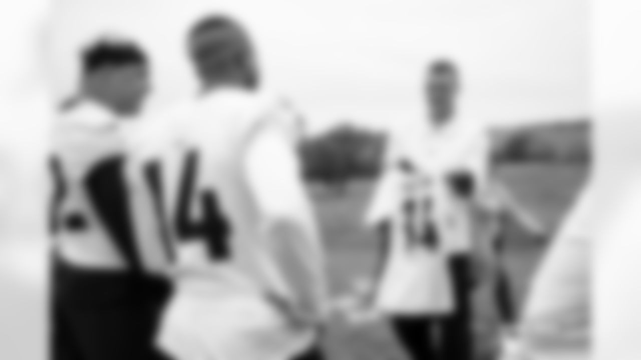 Courtland Sutton receives a custom jersey from Newcastle and England national team defender Dan Burn at practice in Ware, England on October 10, 2025. Photo by Ben Swanson / Denver Broncos