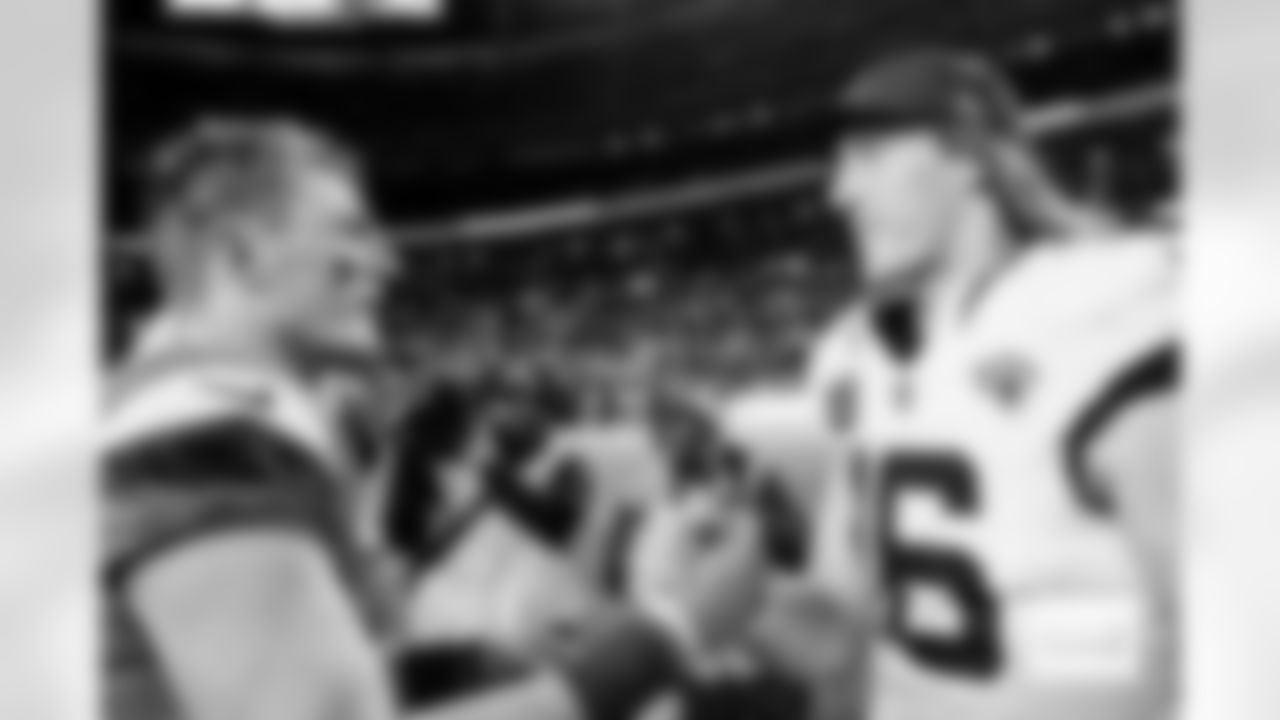 Denver Broncos quarterback Bo Nix (10) greets Jacksonville Jaguars quarterback Trevor Lawrence (16) after the Broncos' Week 16 game against the Jacksonville Jaguars at Empower Field at Mile High in Denver, Colorado on December 21, 2025. Photo by Ben Swanson / Denver Broncos