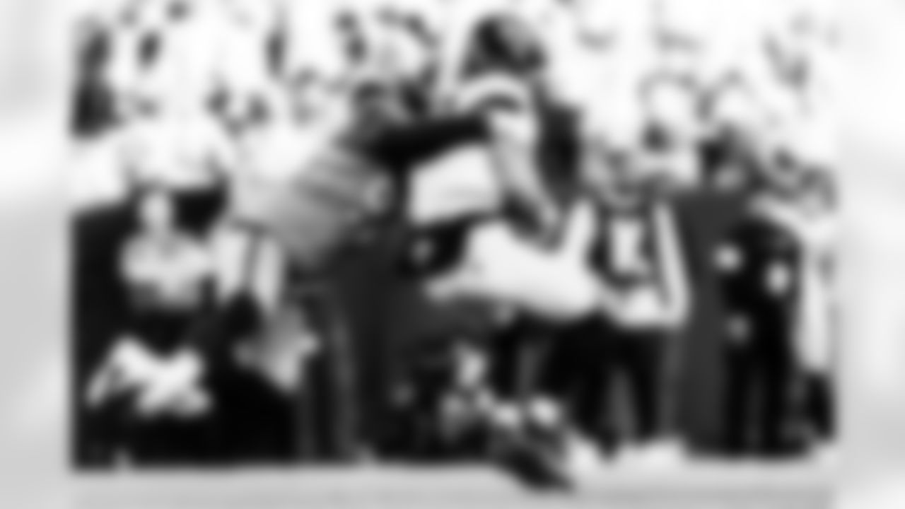 Denver Broncos defensive tackle Malcolm Roach (97) sacks Jacksonville Jaguars quarterback Trevor Lawrence (16) during the Broncos' Week 16 game against the Jacksonville Jaguars at Empower Field at Mile High in Denver, Colorado on December 21, 2025. Photo by Ben Swanson / Denver Broncos