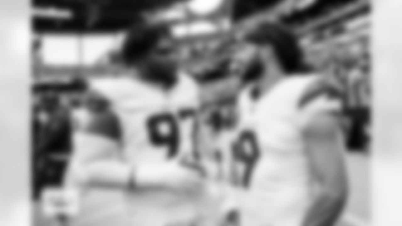 Denver Broncos defensive tackle Malcolm Roach (97) and safety Talanoa Hufanga (9) talk before the Broncos' Week 14 game against the Las Vegas Raiders at Allegiant Stadium in Las Vegas, Nevada on December 7, 2025. Photo by Gabriel Christus / Denver Broncos