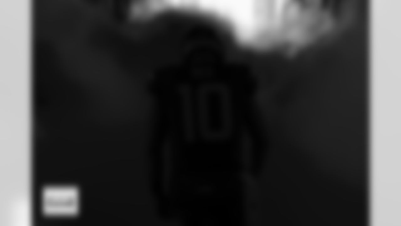 Denver Broncos quarterback Bo Nix (10) runs through the smoke in the tunnel during player and team introductions before the Broncos' Week 16 game against the Jacksonville Jaguars at Empower Field at Mile High in Denver, Colorado on December 21, 2025. Photo by Ben Swanson / Denver Broncos