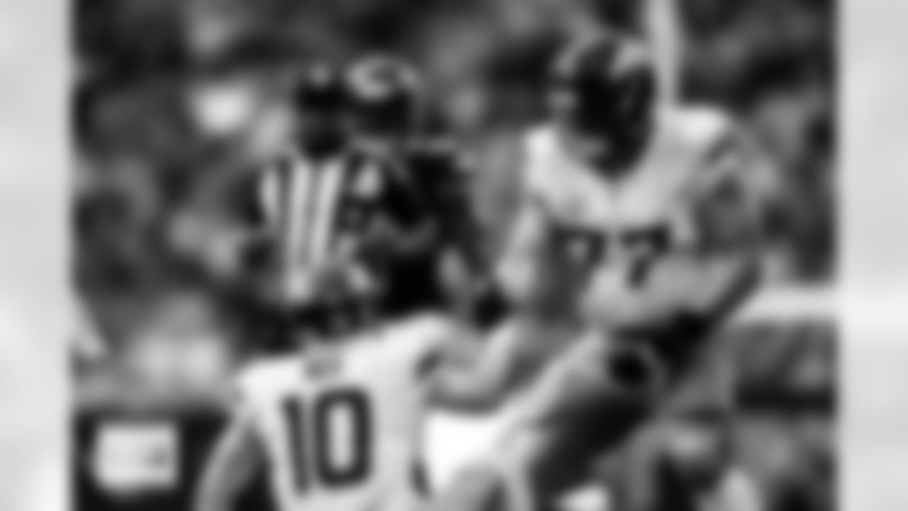 Denver Broncos guard Quinn Meinerz (77) helps quarterback Bo Nix (10) up during the Broncos' Week 9 game against the Houston Texans at NRG Stadium in Houston, Texas on November 2, 2025. Photo by Gabriel Christus / Denver Broncos