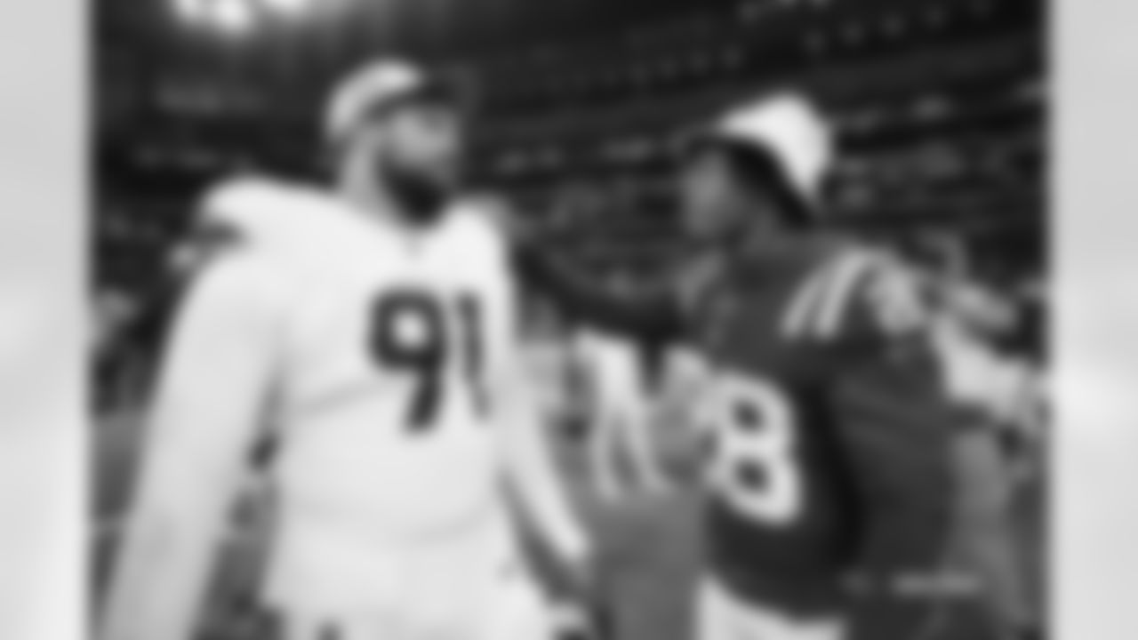 Matt Henningsen #91 of the Denver Broncos talks with Jonathan Taylor #28 of the Indianapolis Colts after the Broncos' preseason Week 1 game against the Indianapolis Colts at Lucas Oil Stadium in Indianapolis, Indiana on August 11, 2024. (Photo by Ben Swanson/Denver Broncos)