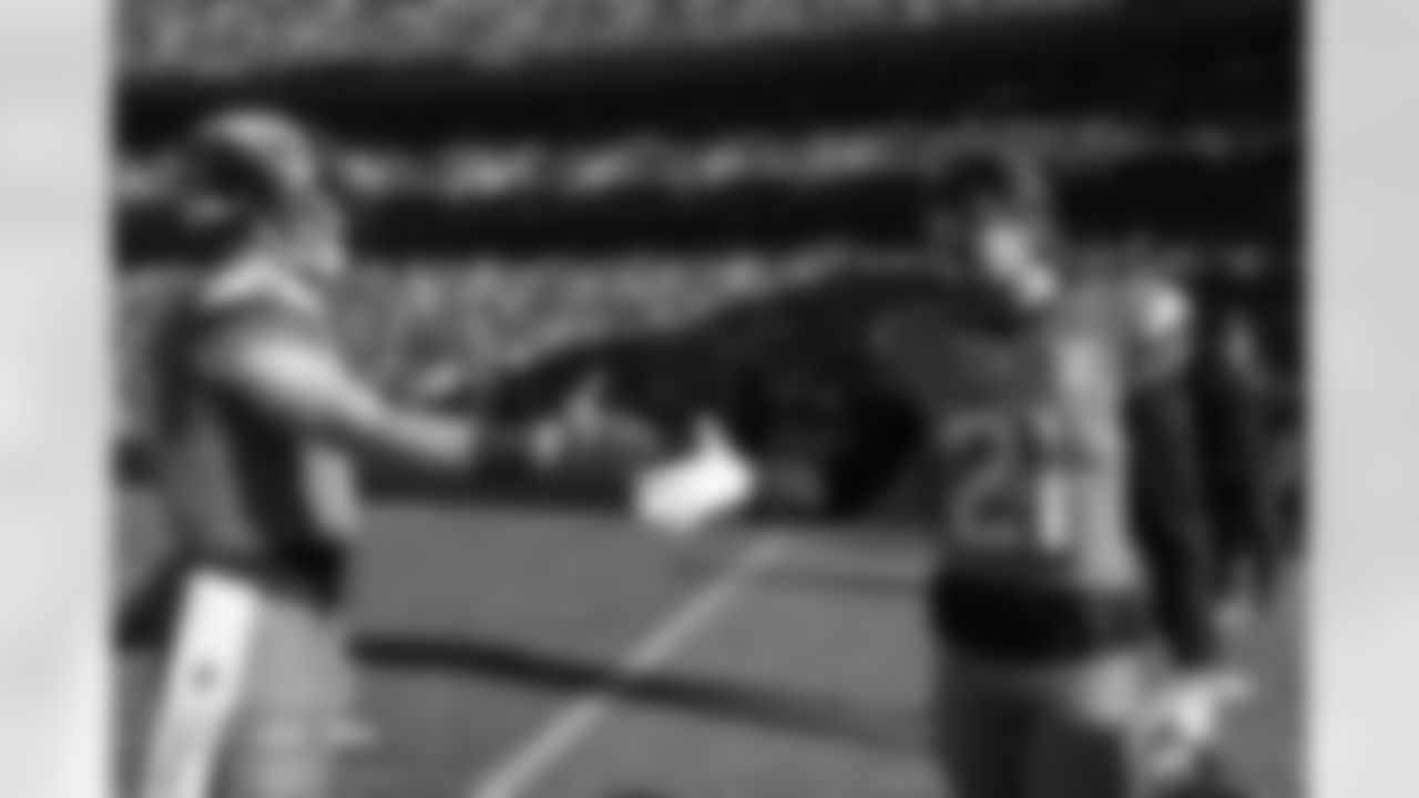 Bo Nix and Riley Moss (21) before the Broncos' Week 16 game against the Jacksonville Jaguars at Empower Field at Mile High in Denver, Colorado on December 21, 2025. Photo by Ben Swanson / Denver Broncos