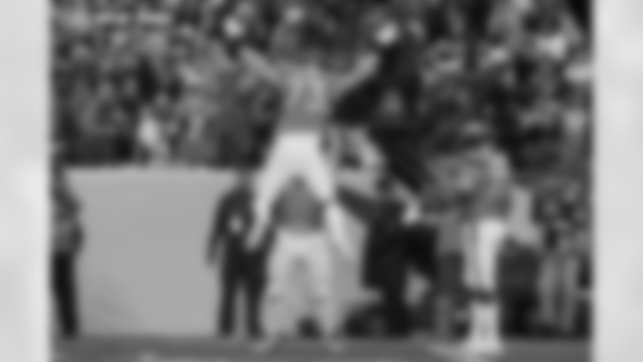 Frank Crum (73) is lifted by Quinn Meinerz during the Broncos' Divisional Round playoff game against the Buffalo Bills at Empower Field at Mile High in Denver, Colorado on January 17, 2026. Photo by ADAM BRATTEN / Denver Broncos