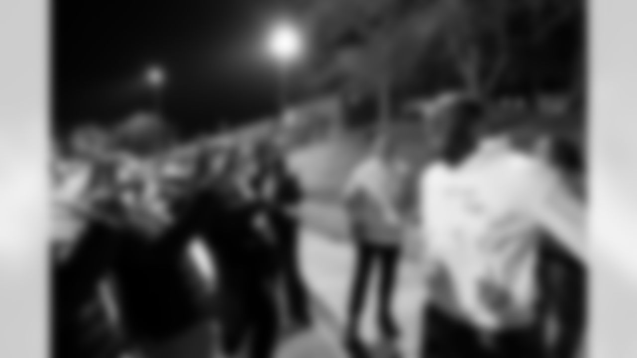 Delarrin Turner-Yell laughs with Talanoa Hufanga and Cherry Creek High School students during a visit to watch Cherry Creek play Fountain Fort Carson on Friday, November 14, 2025 at Cherry Creek High School in Greenwood Village, Colorado.
Photo by Gabriel Christus / Denver Broncos