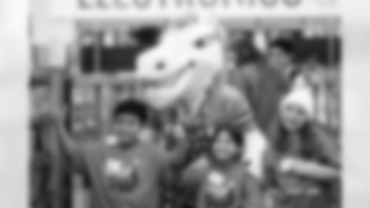 Children from the Boys & Girls Club participate in a Shop with a Jock shopping spree with Broncos players, alumni and cheerleader alumni in Aurora, Colorado on December 15, 2025. Photo by Ben Swanson / Denver Broncos