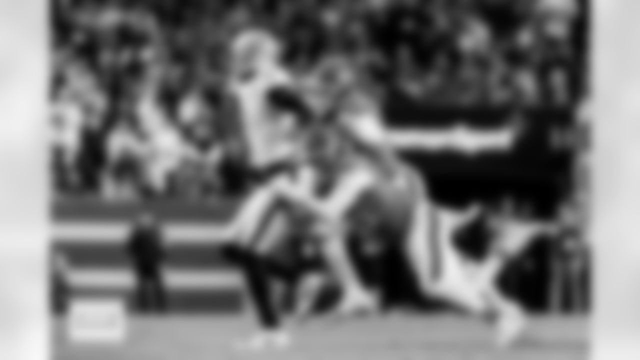 Denver Broncos linebackers Nik Bonitto (15) and Jonathon Cooper (0) chase down Raiders quarterback Geno Smith during the Broncos' Week 10 game against the Las Vegas Raiders at Empower Field at Mile High in Denver, Colorado on November 6, 2025. Photo by Gavin Liddell / Denver Broncos
