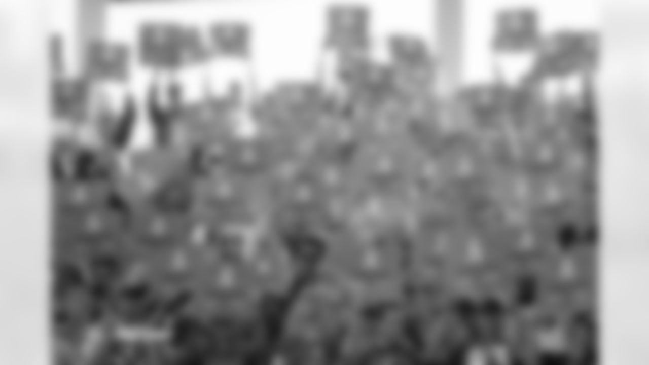 Fans hold up Salute to Service cards before the Broncos' Week 11 game against the Kansas City Chiefs at Empower Field at Mile High in Denver, Colorado on November 16, 2025. Photo by Ben Swanson / Denver Broncos