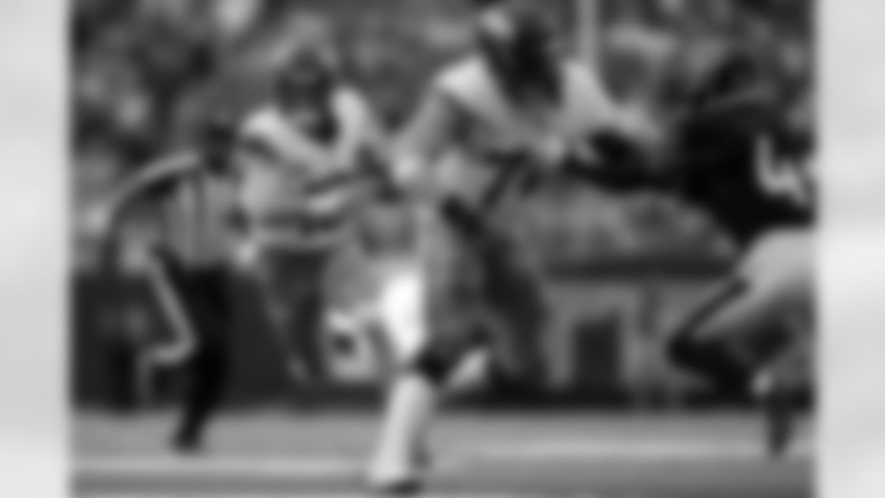 Denver Broncos offensive tackle Garett Bolles (72) blocks for quarterback Bo Nix (10) as he runs during the Broncos' Week 9 game against the Houston Texans at NRG Stadium in Houston, Texas on November 2, 2025. Photo by Gabriel Christus / Denver Broncos